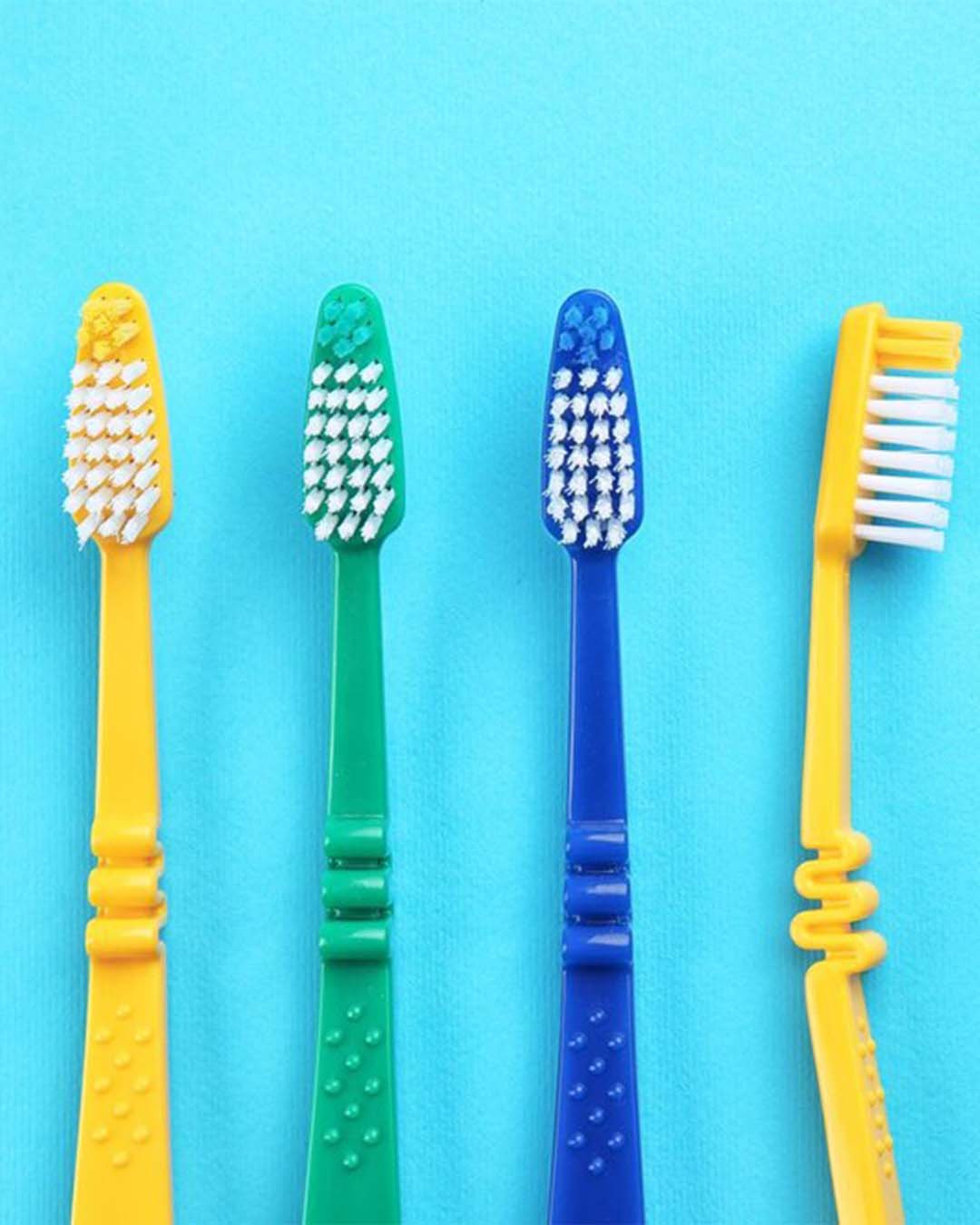 set-toothbrushes-color-background_392895-316305